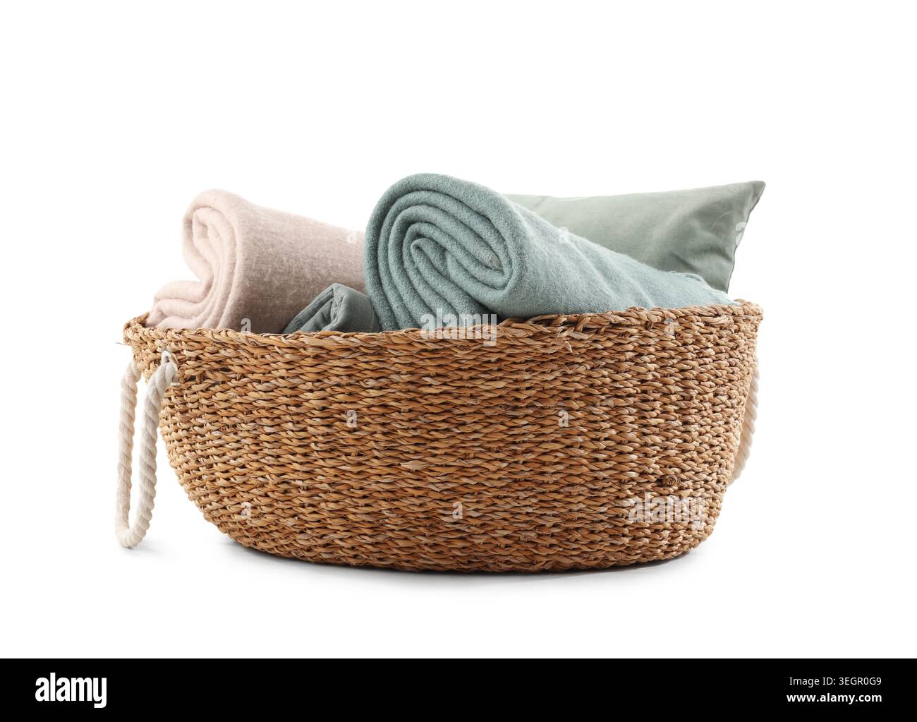 Wicker basket with different cozy blankets isolated on white background Stock Photo