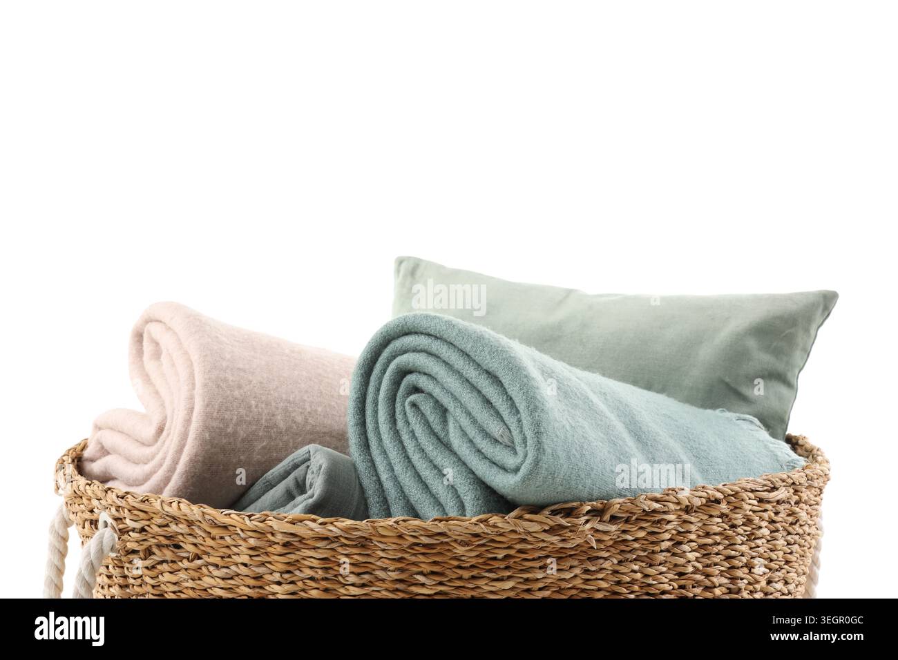 Wicker basket with different cozy blankets isolated on white background Stock Photo