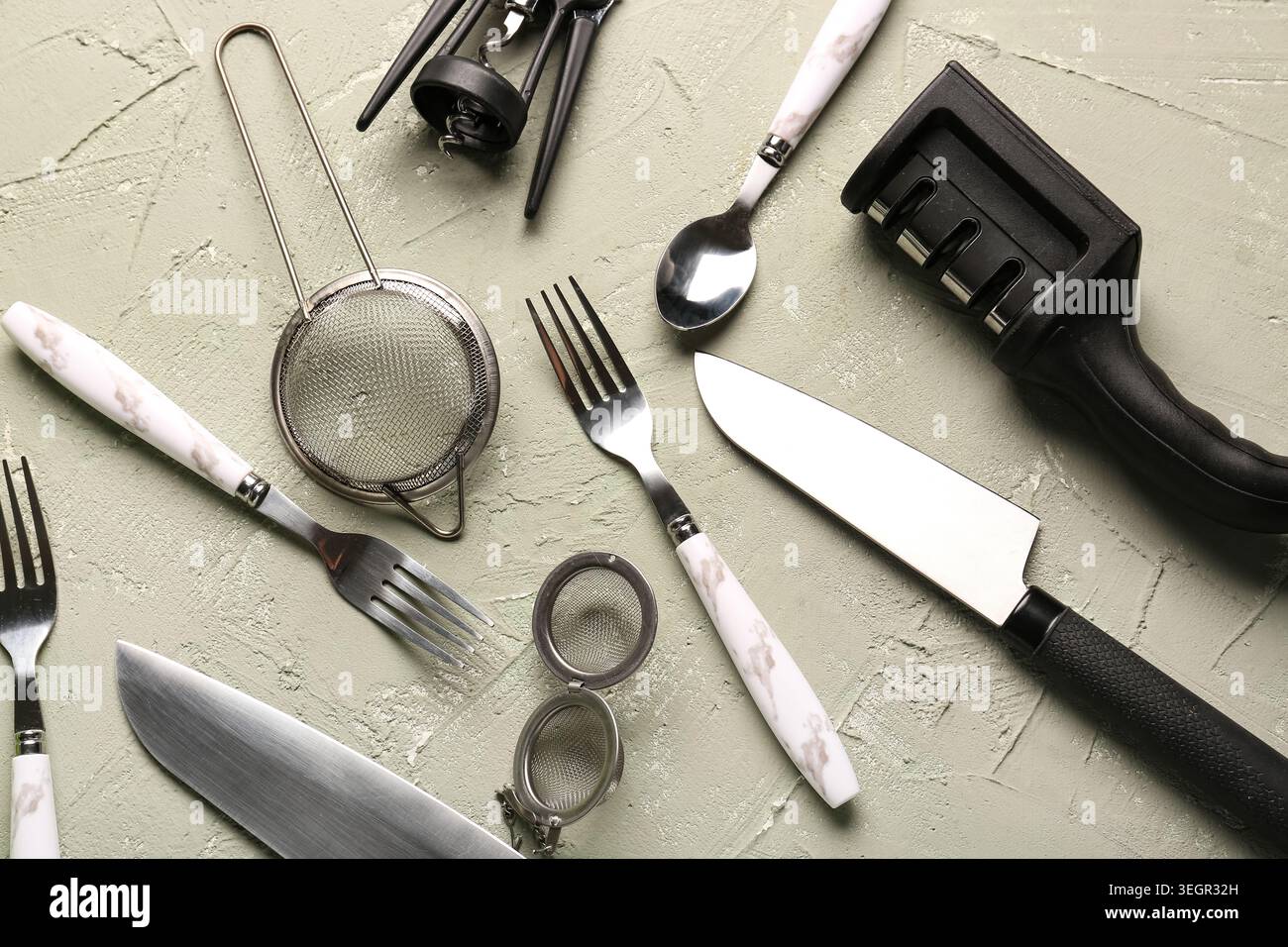 Different kitchen utensils on grey background Stock Photo