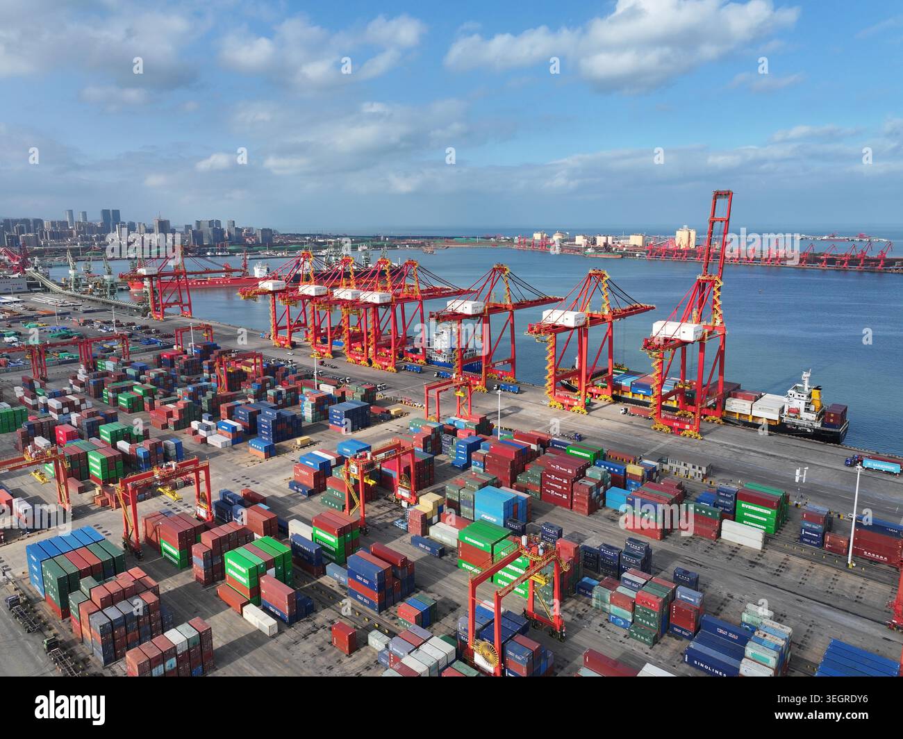 Shuttle Container Port A container ship docks at Rizhao Port in east China's Shandong Province ...