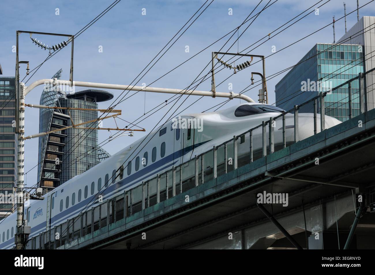 Street view of Japan's Nozomi Shinkanzen bullet train departing from ...