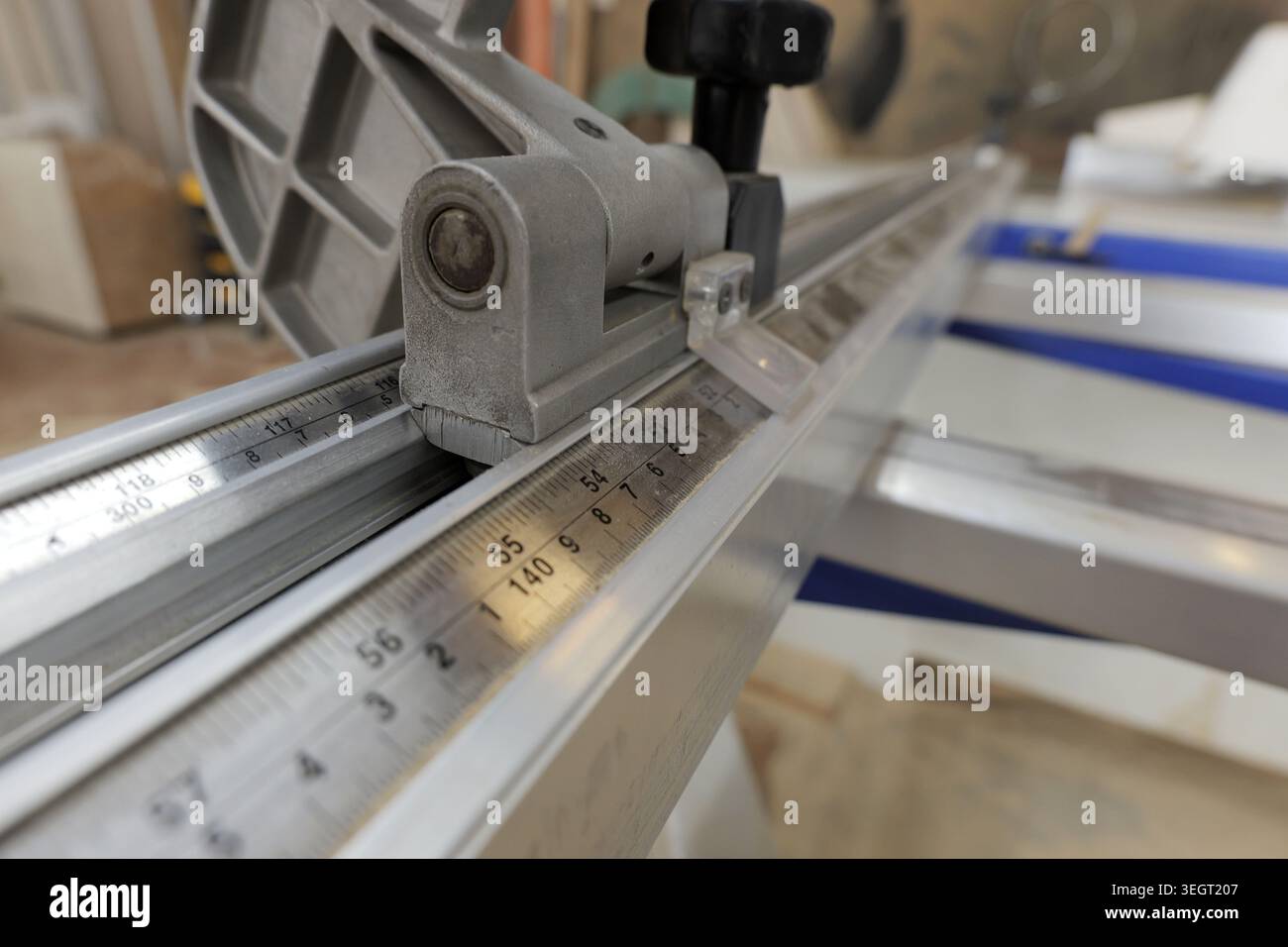 Close up view of a professional sliding table saw's precision guide ...