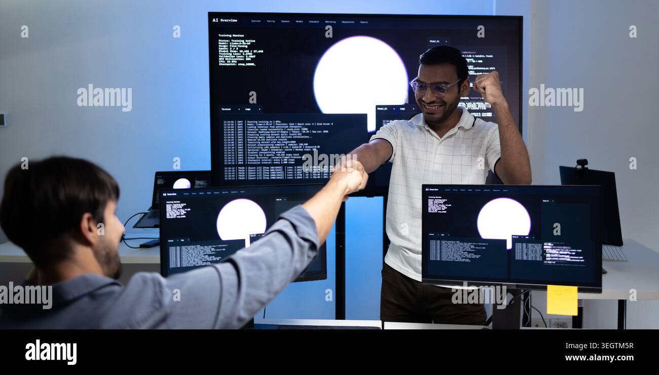 Software Developers Celebrating AI Training Success In Modern Tech Office Stock Photo
