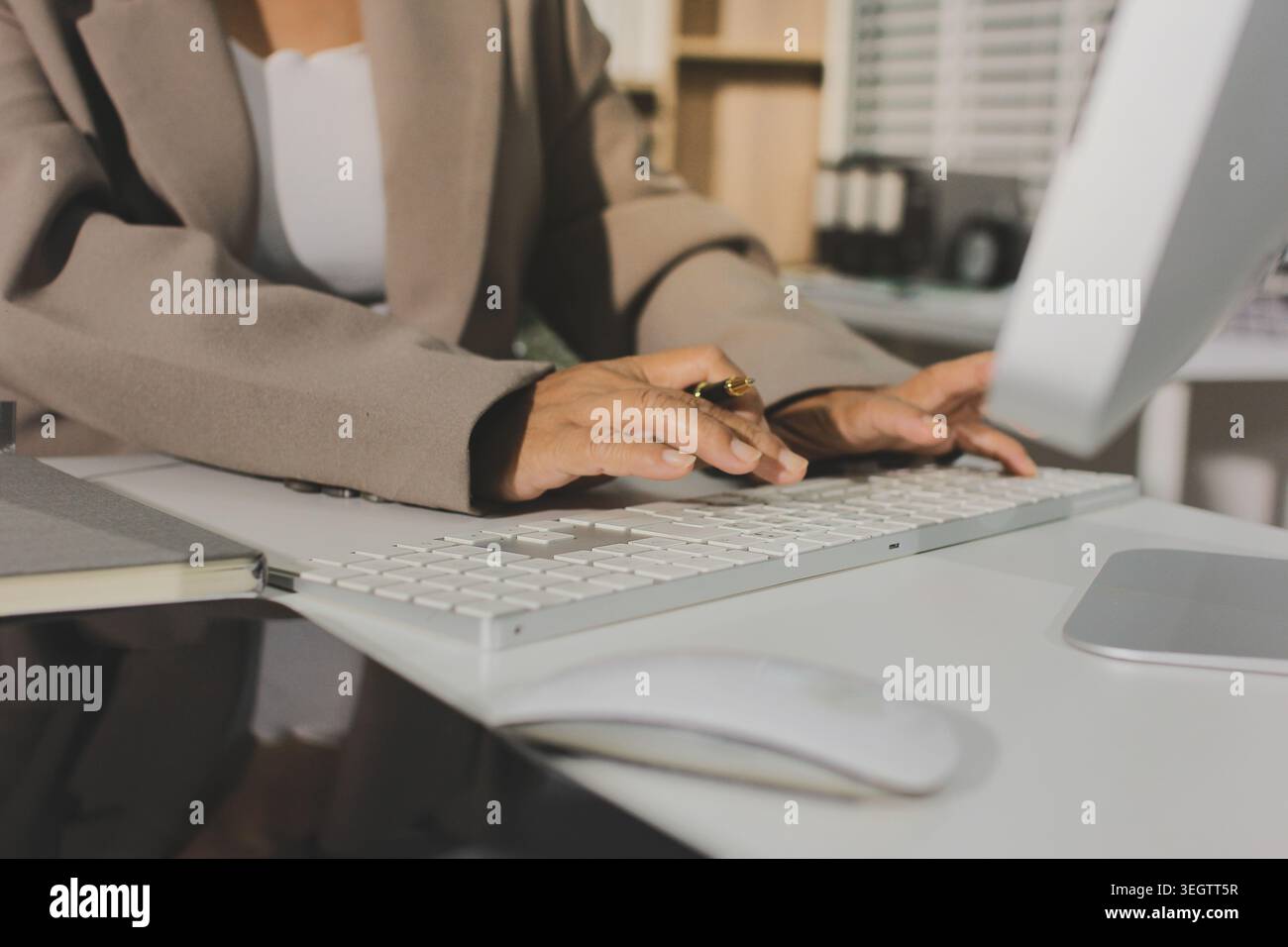 Two young Asian businesswomen discuss investment project working and ...