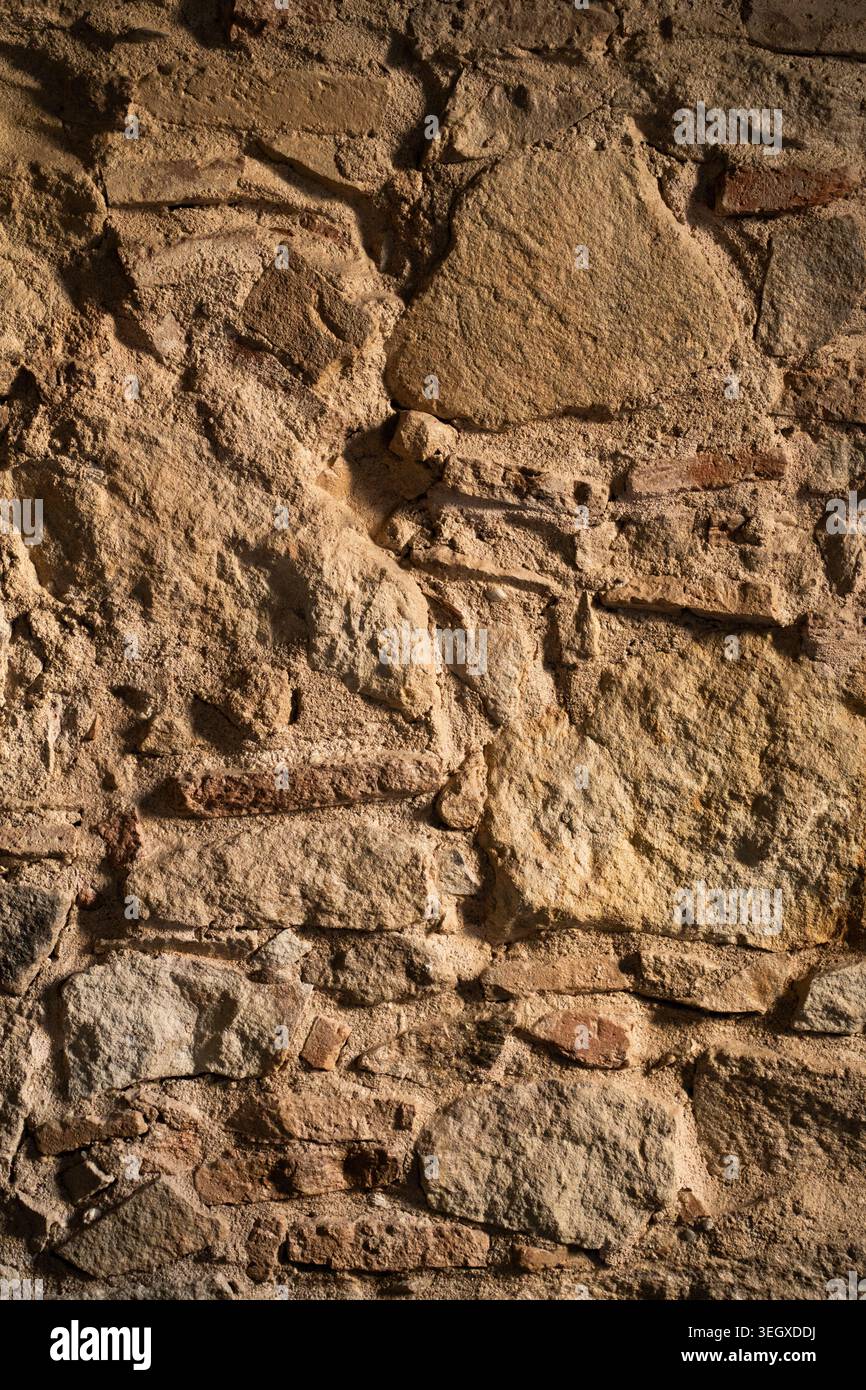 Ancient stone wall showcasing a rough Stock Photo