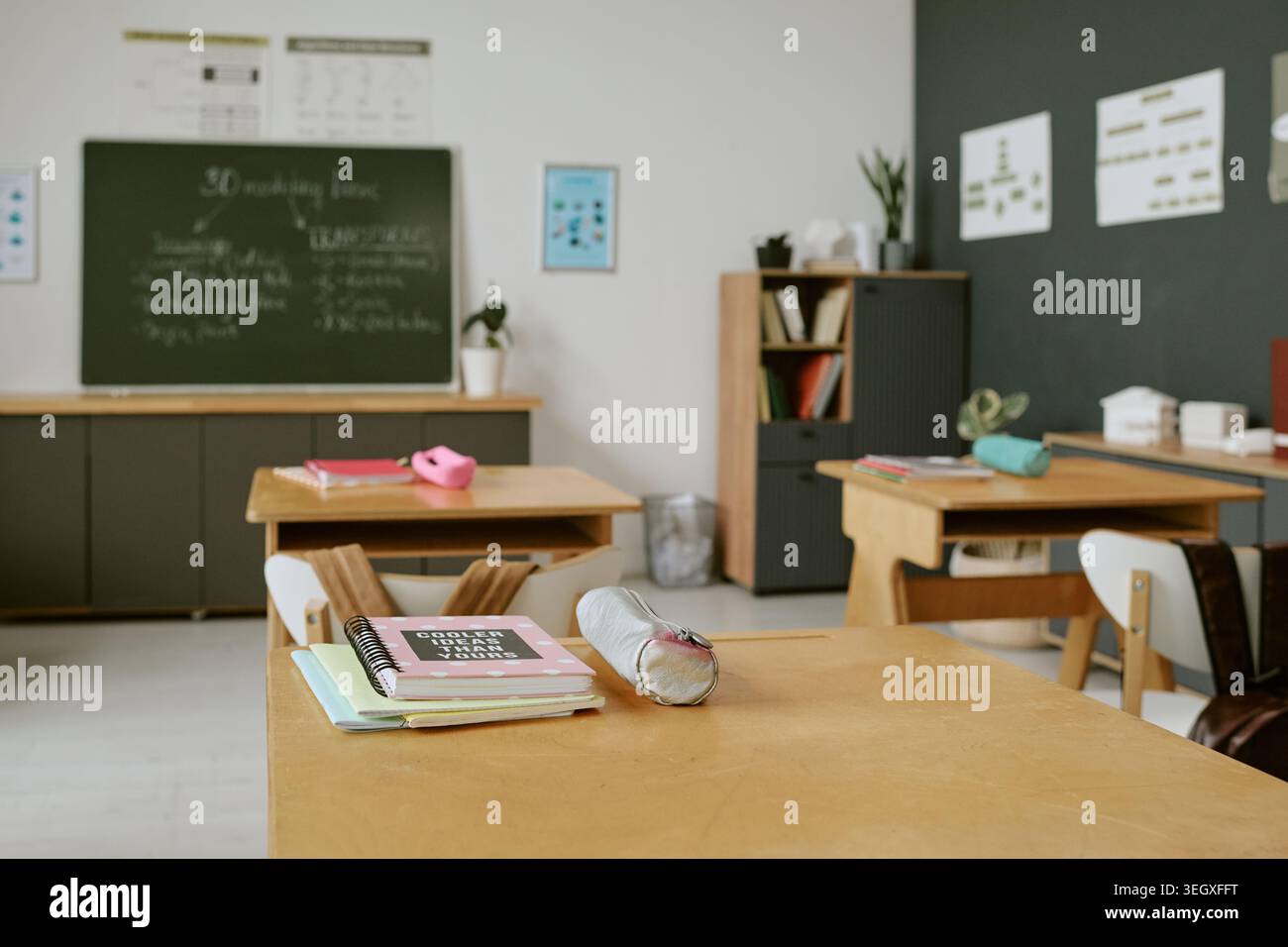 Empty Classroom Showing School Desks and Learning Materials Stock Photo