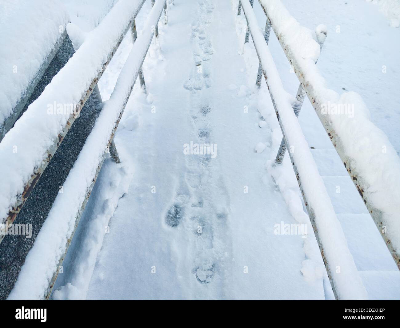 Rusted Ramp Snow Ramp With Footprints Between Rusted Metal Railings On Urban ...