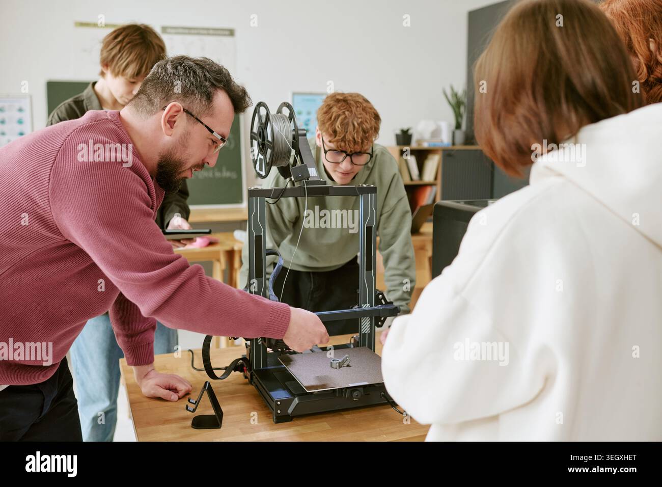 Teacher and Teenagers Operating 3d Printer in Stem Classroom Stock ...