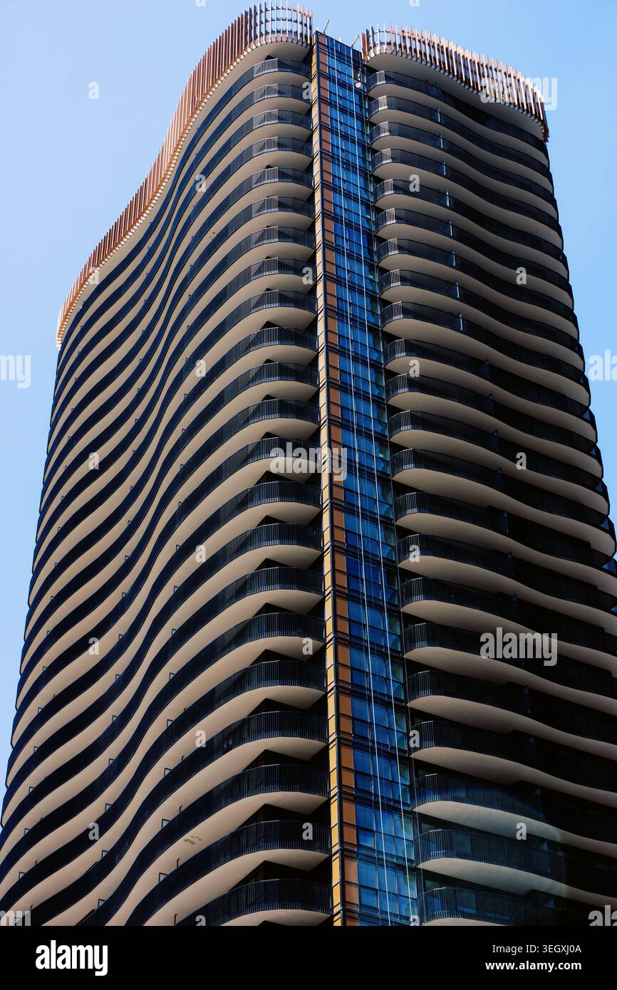 Modern high rise building with wavy balconies and glass facade Stock ...