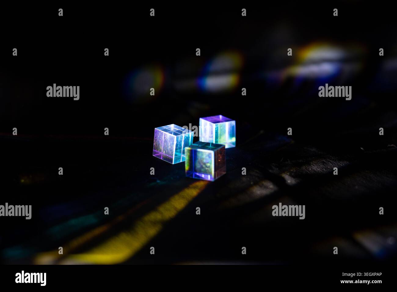Transparent cubes with neon light reflections on dark textured background Stock Photo