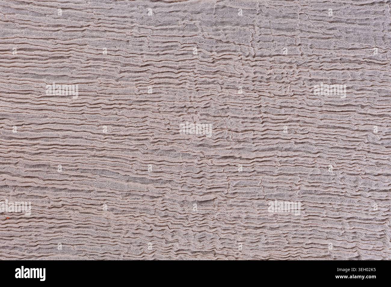 Beige Crinkled Muslin Fabric Texture Background Stock Photo
