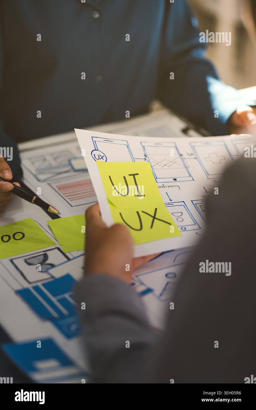 Team of Program Developer Collaborating on UXUI Design Planning in a Modern Office Environment Stock Photo