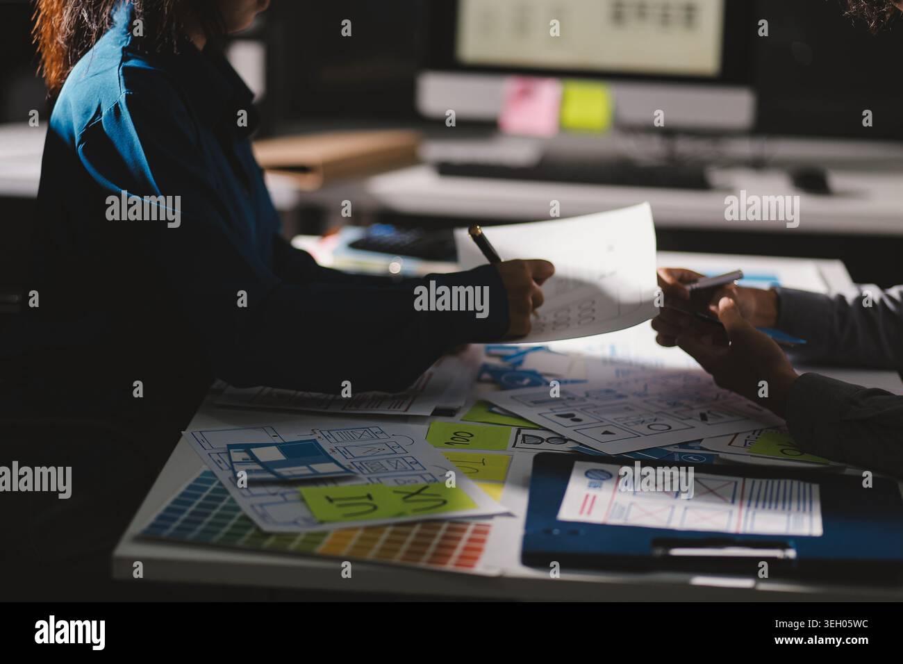 Team of Program Developer Collaborating on UXUI Design Planning in a Modern Office Environment Stock Photo