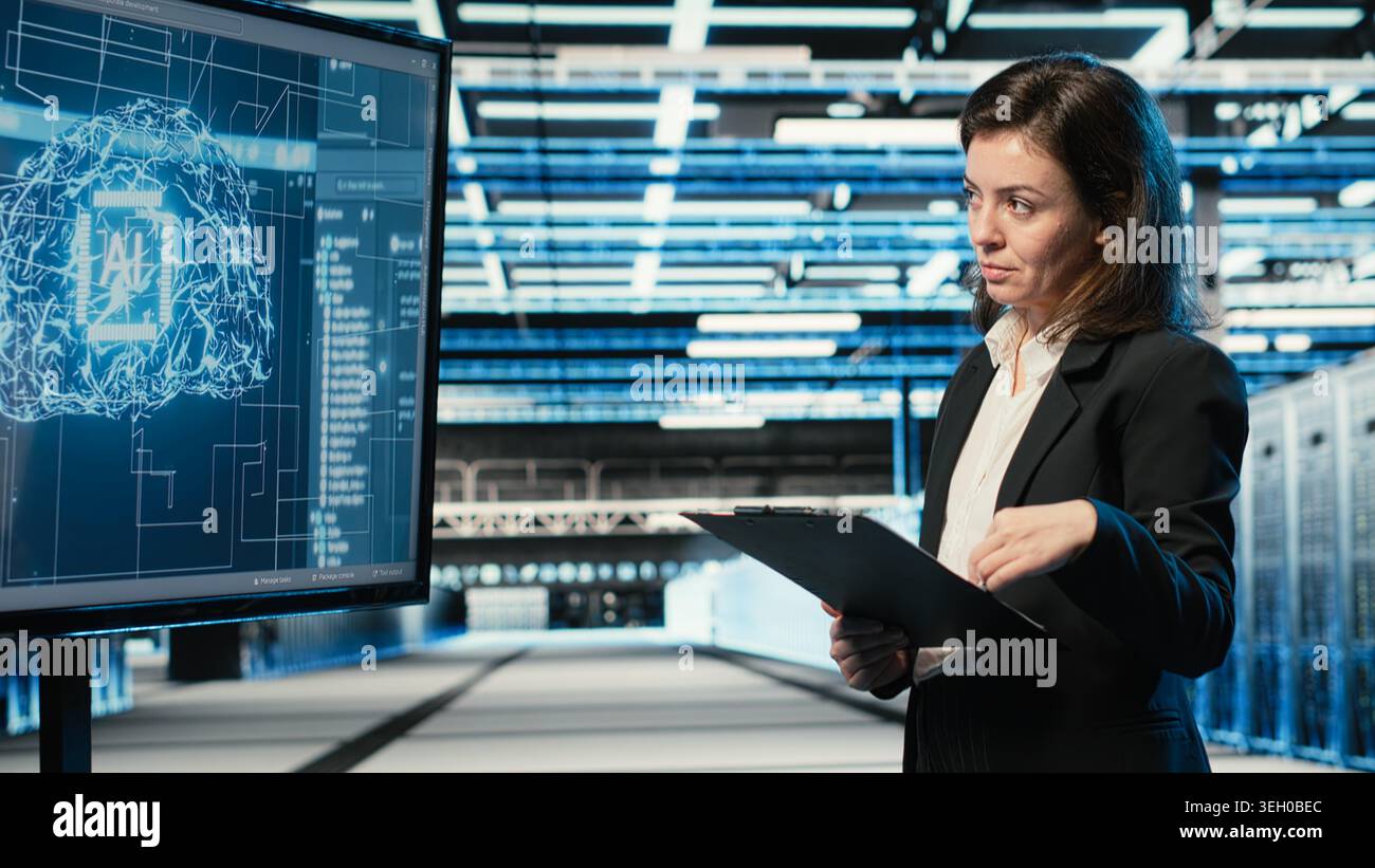 Monitoring systems, artificial intelligence tech and engineer in automated industrial data center. Using AI, machine learning and IT expert in server room overseeing network performance Stock Photo