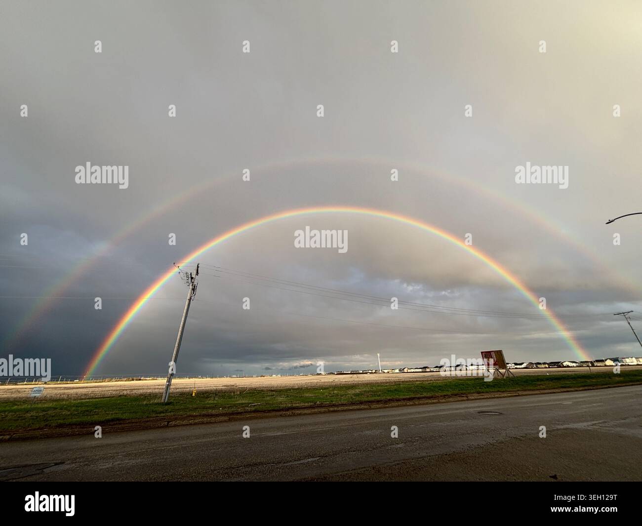Double Rainbow Over Suburban Houses Stock Photo