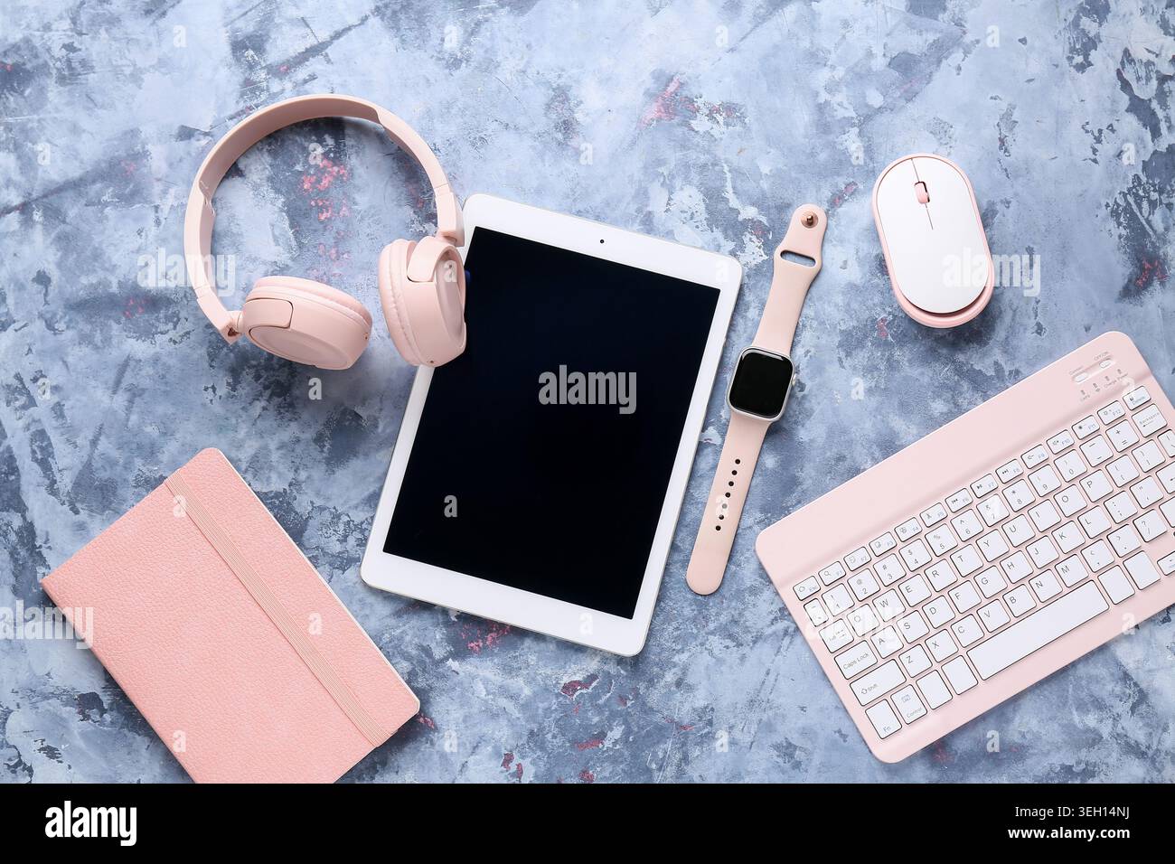 Composition with different modern gadgets and notebook on blue grunge background, closeup Stock Photo