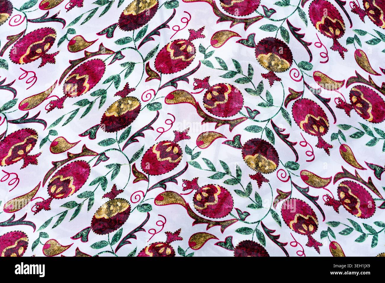 Background, fabric texture with a pomegranate pattern. Concept: interior, cosmetics packaging, textile prints Stock Photo