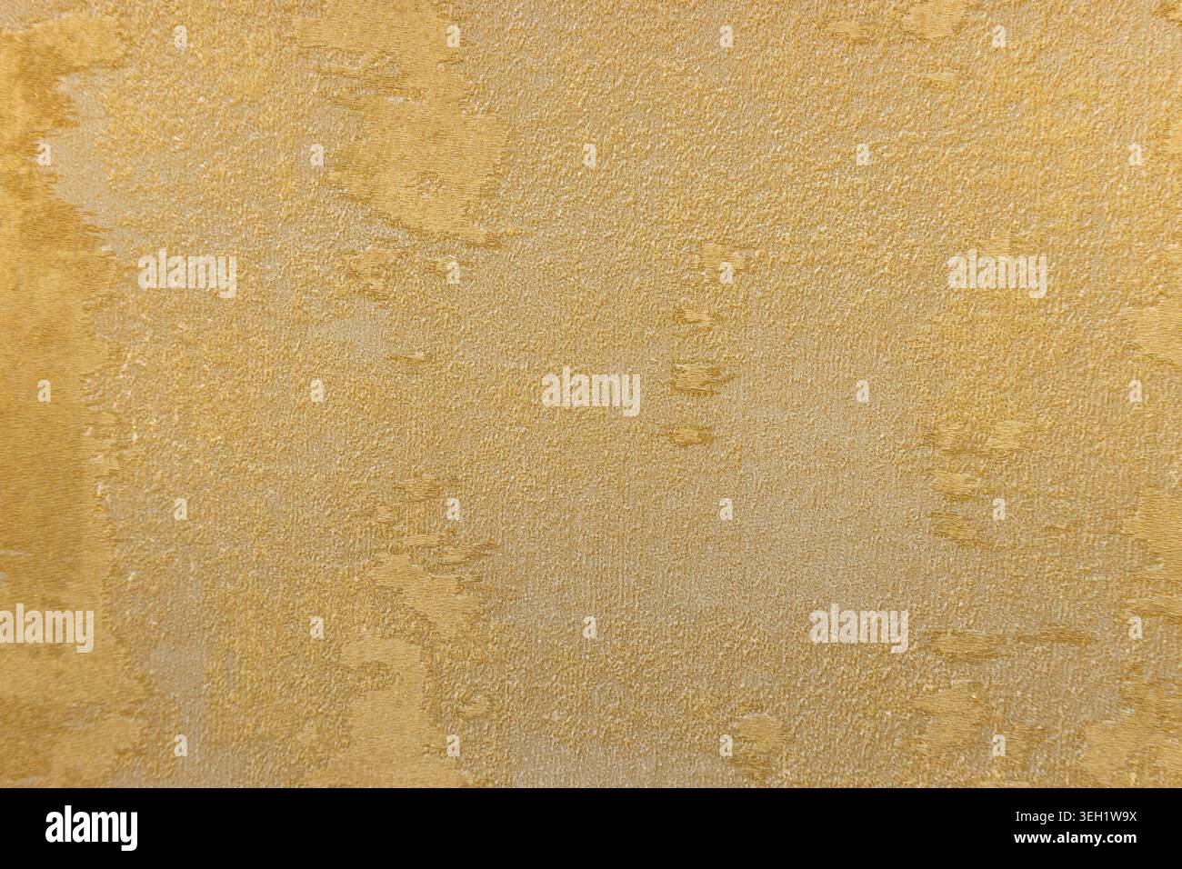 Gold textured wallpaper background with elegant plaster pattern Stock Photo