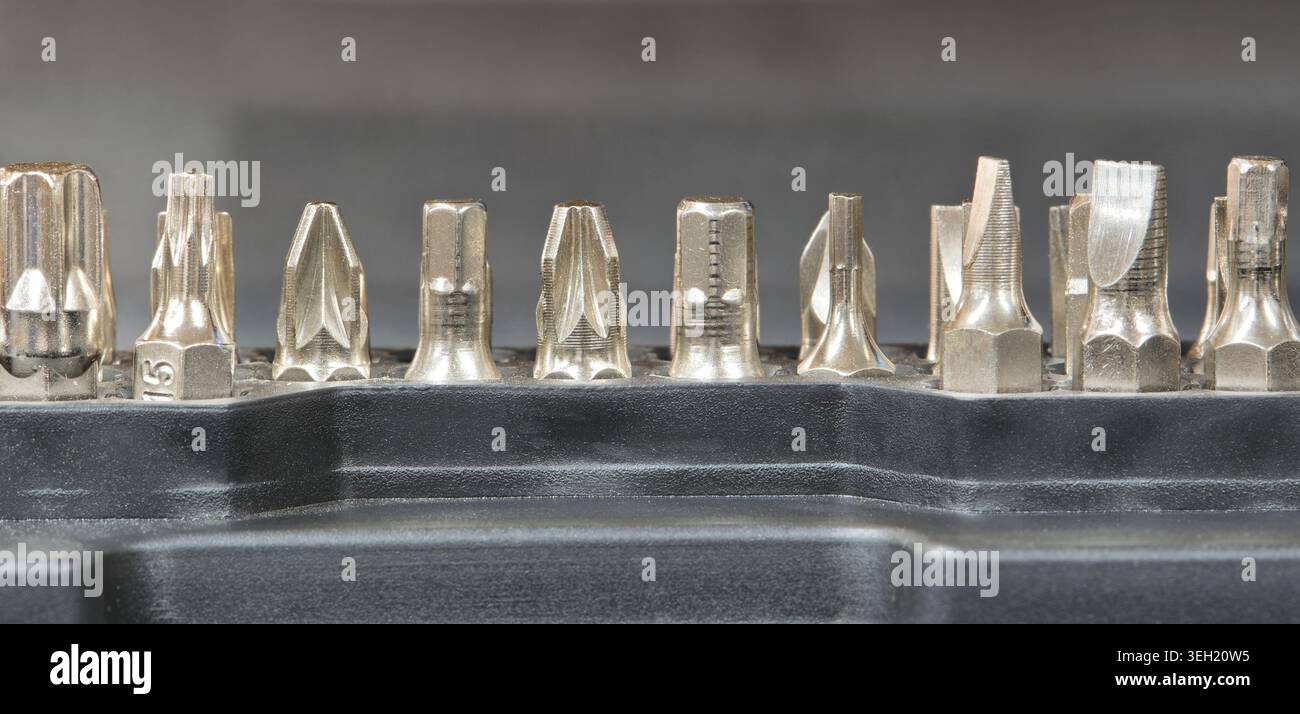 Drill screwdriver bits socket set network tool repair kit metal fastener mechanical components. Stock Photo