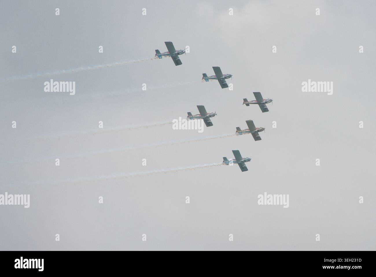 Five planes soar in perfect formation. Stock Photo