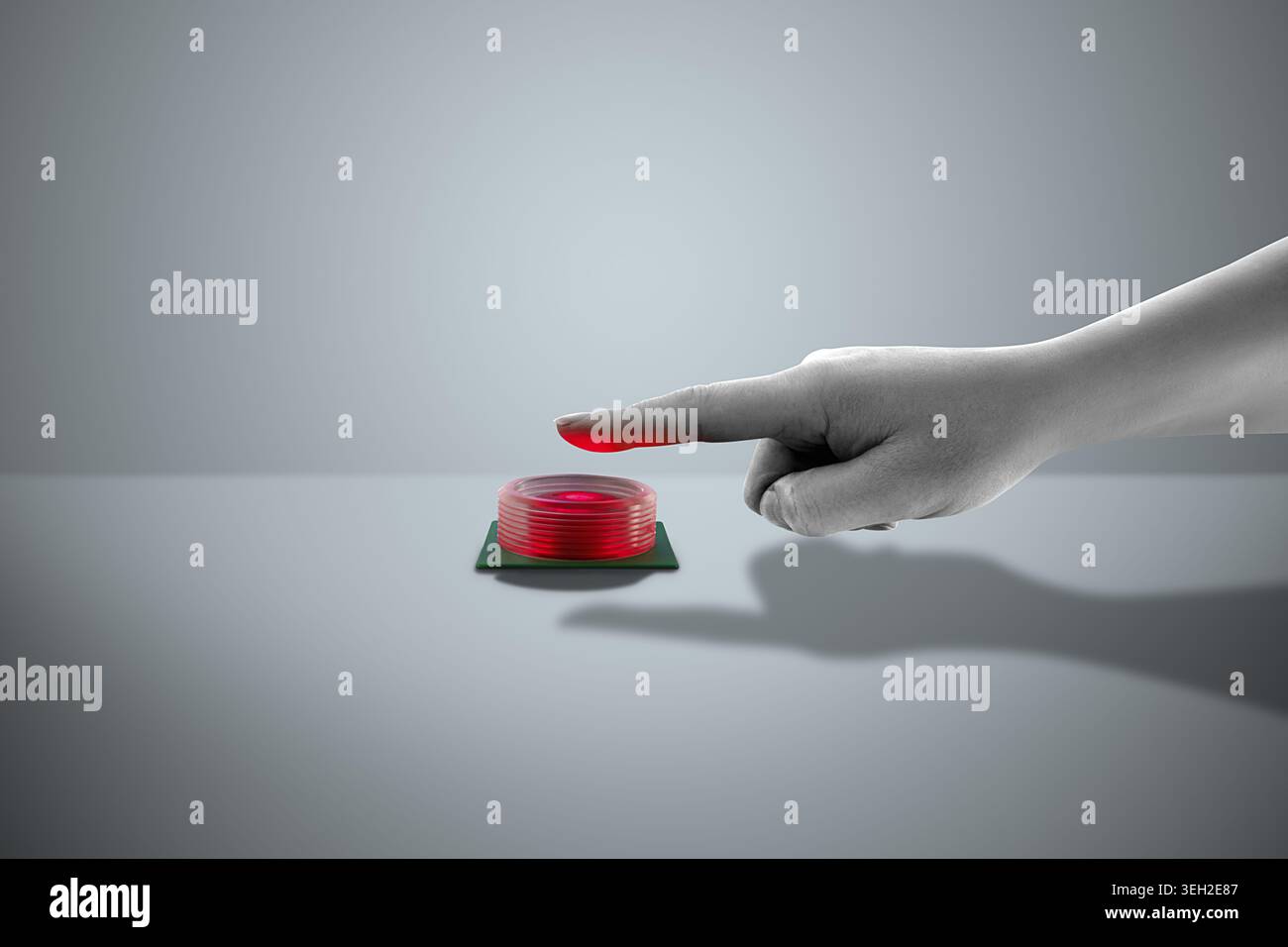 A hand pressing a red button on a gray surface. Flat design art with copy space. Stock Photo