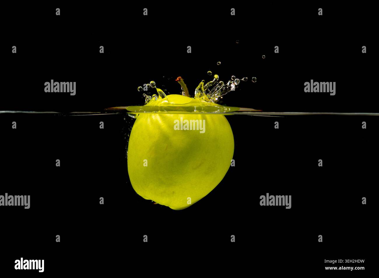 Dynamic Image Of Lime Halting Midair Splatter With Crown Droplets In Studio Setting Stock Photo
