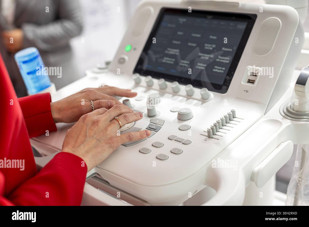 Doctor Controls Doctor adjusting ultrasound machine controls hi-res stock photography ...