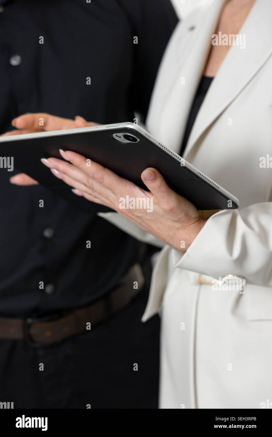Business Professionals Using Digital Tablet During Meeting Stock Photo