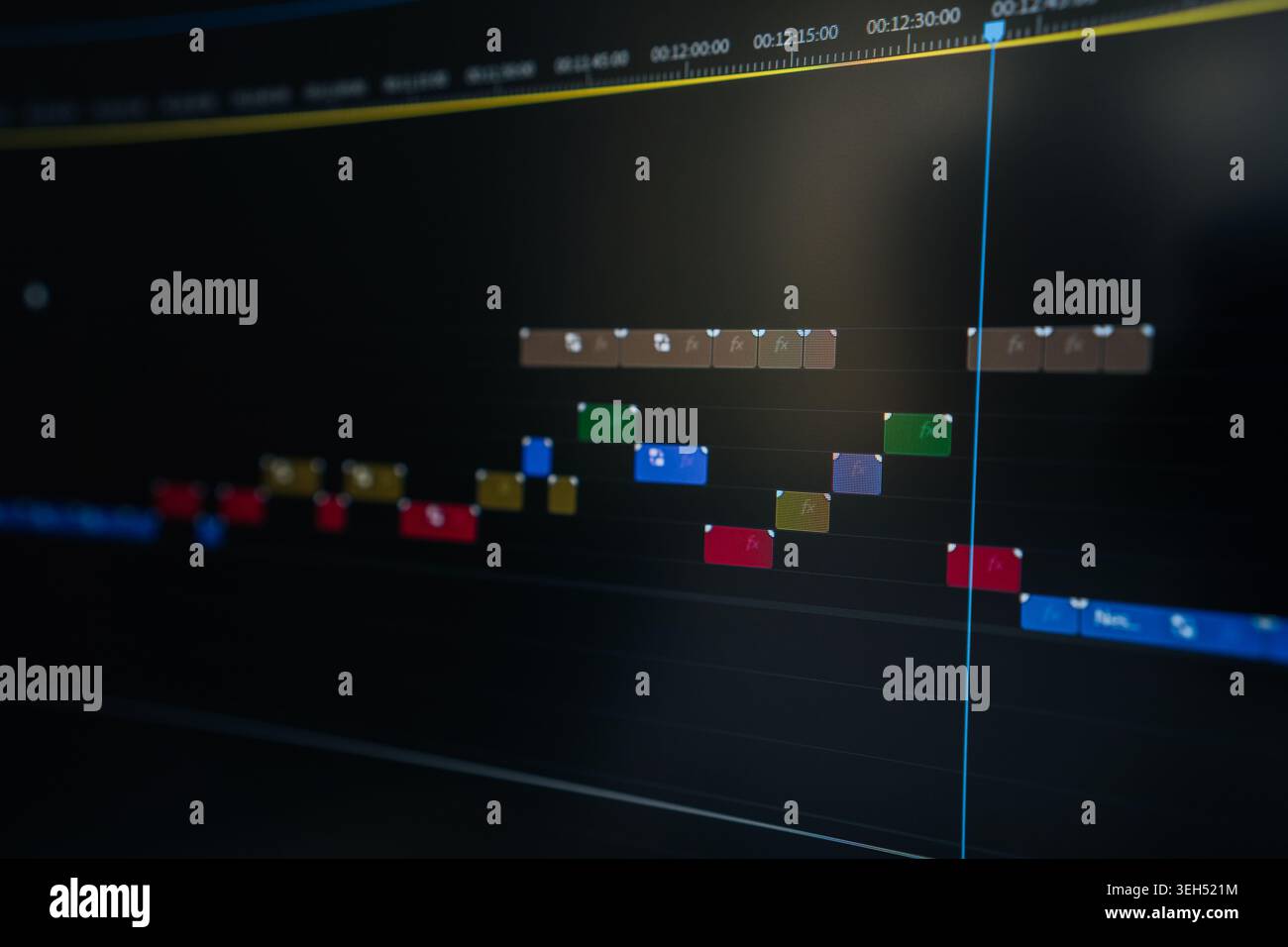 Editing video on digital timeline, showing clips, effects, audio tracks in software interface for multimedia production and creative post-production Stock Photo