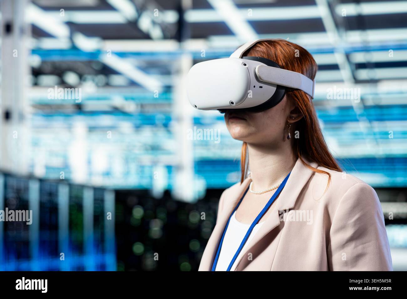 Data center programmer using VR headset gear to manage database storage mainframes. Server farm worker uses virtual reality tech to monitor internet cloud computing hardware, technology concept Stock Photo