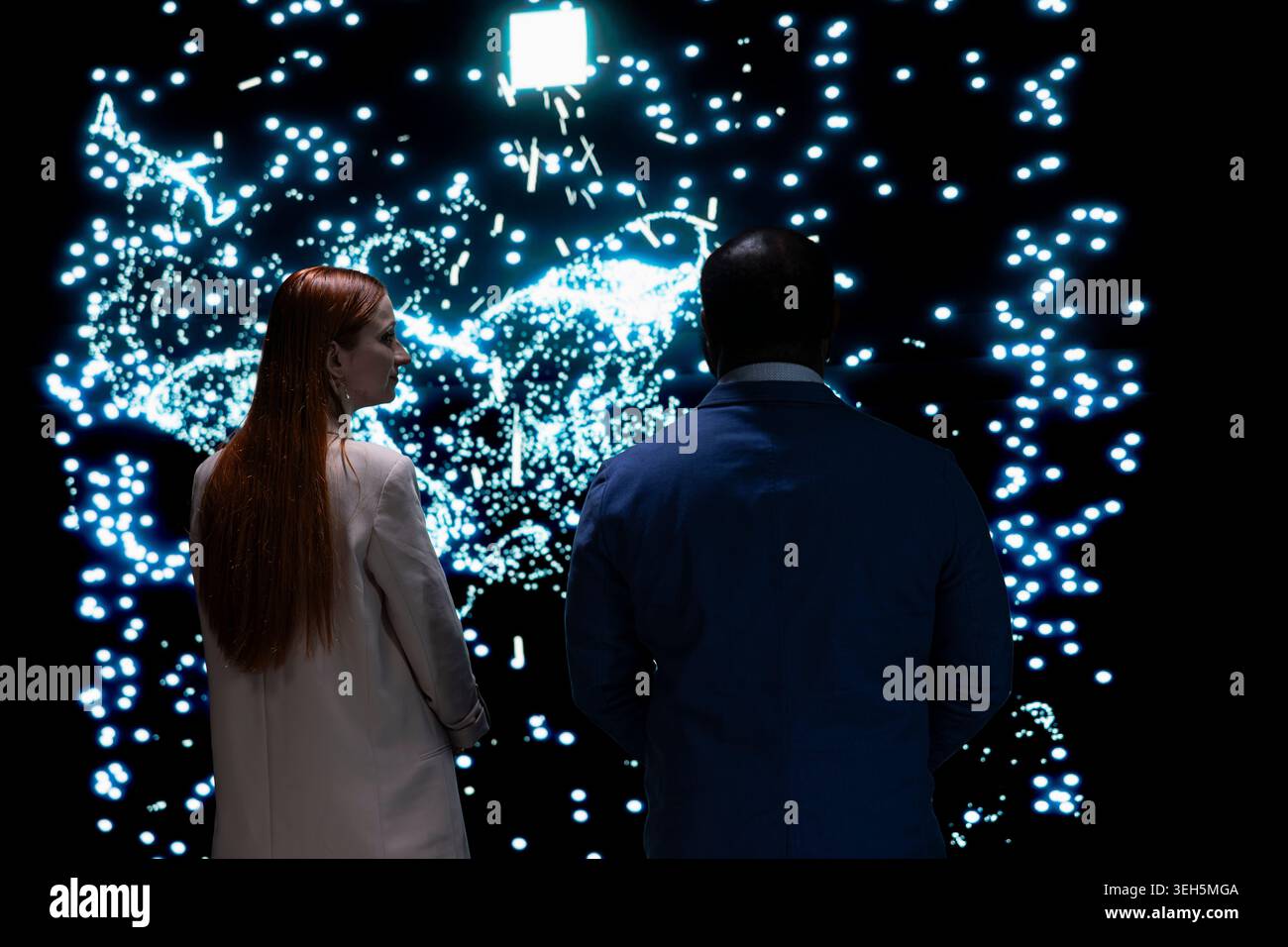 Engineering team implementing machine learning algorithms for AI system, working together. Tech startup colleagues discuss about artificial intelligence neural network architecture Stock Photo