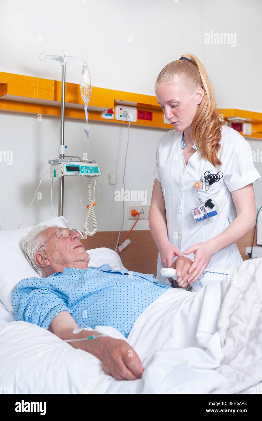 Nurse checking on patient. Stock Photo
