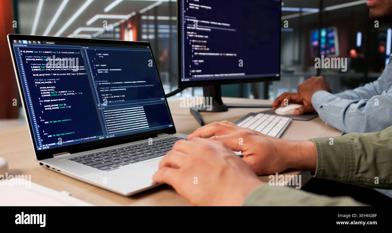 Two Software Engineers Working Together On Secure Data Coding Project. Stock Photo