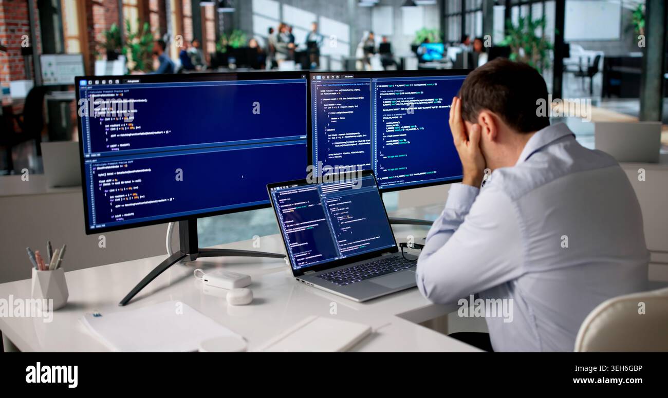 Frustrated Programmer Struggles Alone Late Night Coding Web Software. Stock Photo