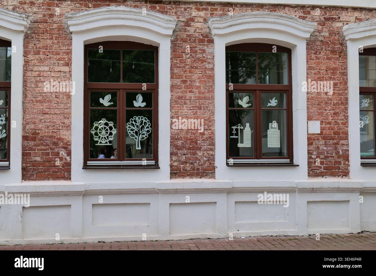 Red Brick Building Facade with Two Windows Stock Photo