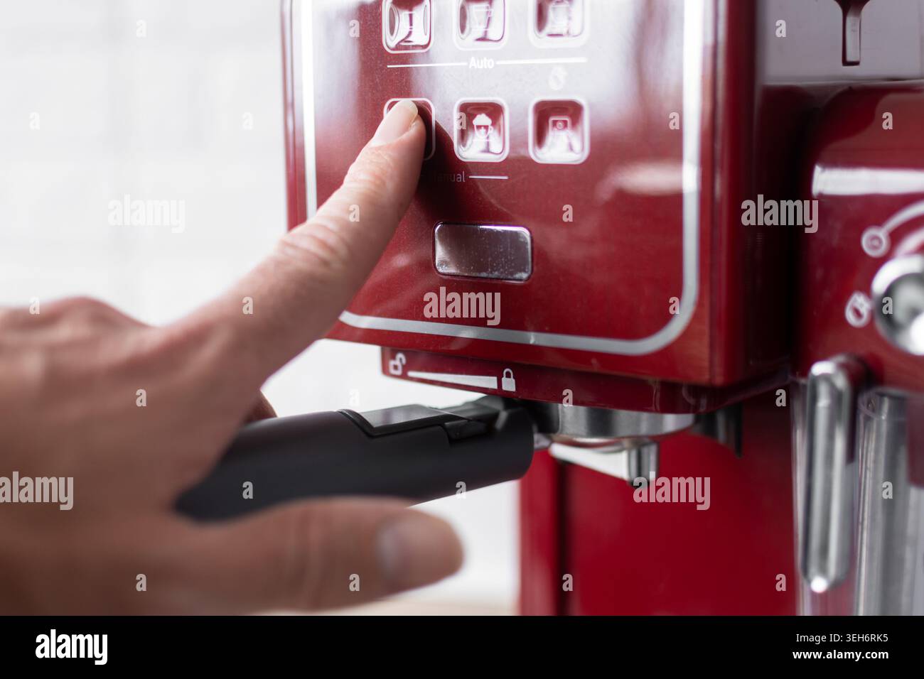Preparing espresso coffee in a modern kitchen.Close up. Stock Photo