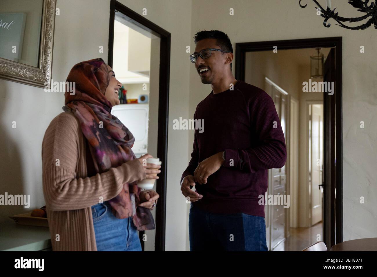 Faisal Rashid, right, and his wife Samiha Matin, laugh as they make ...