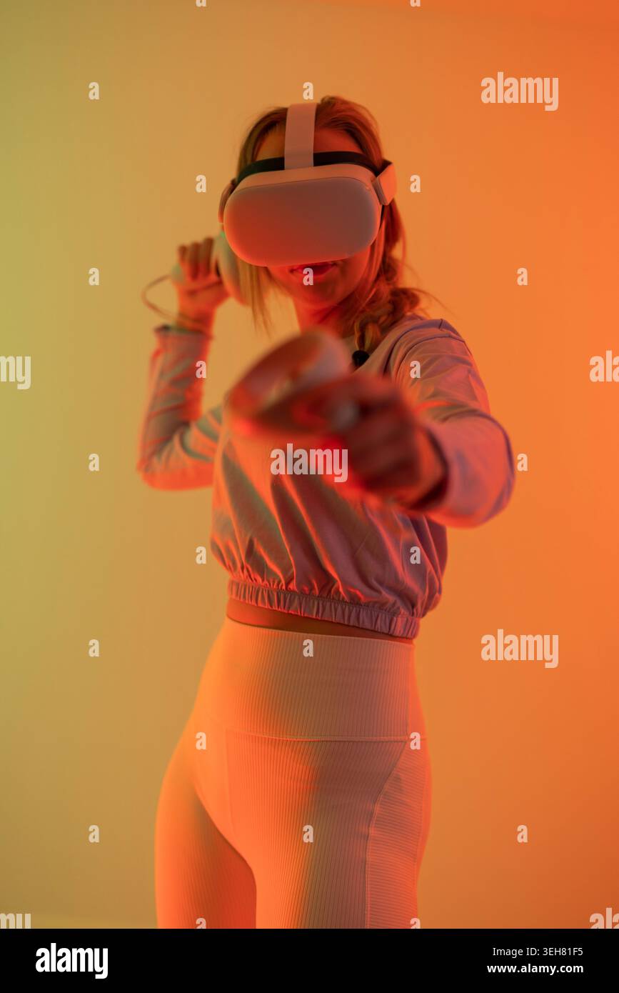 Woman immersed in virtual reality Stock Photo