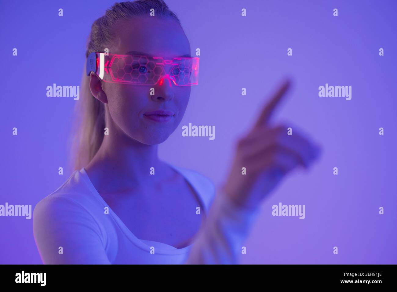 Woman Interacting with Virtual Interface Stock Photo