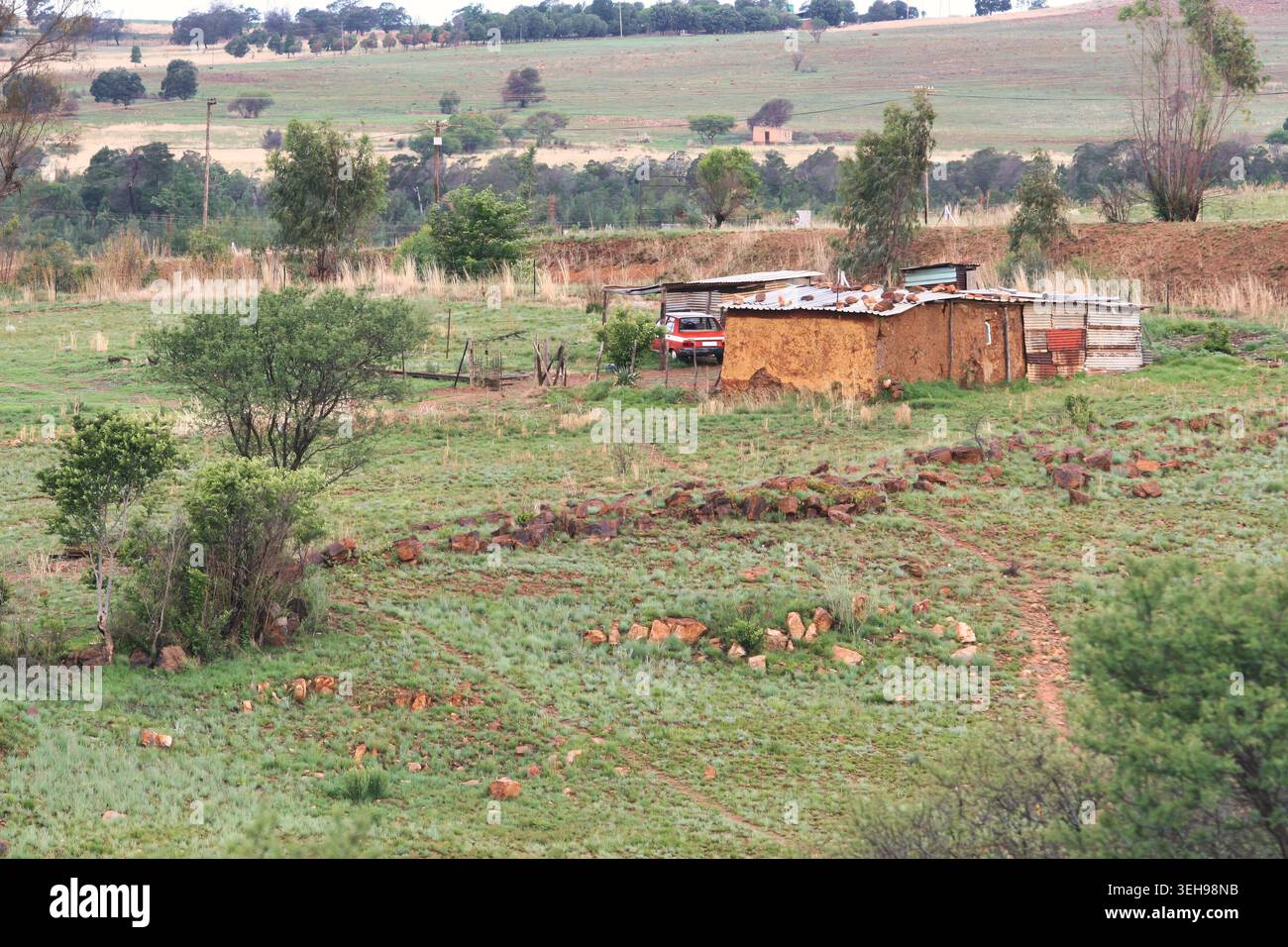 hillside view of a rural informal settlement in South Africa featuring ...