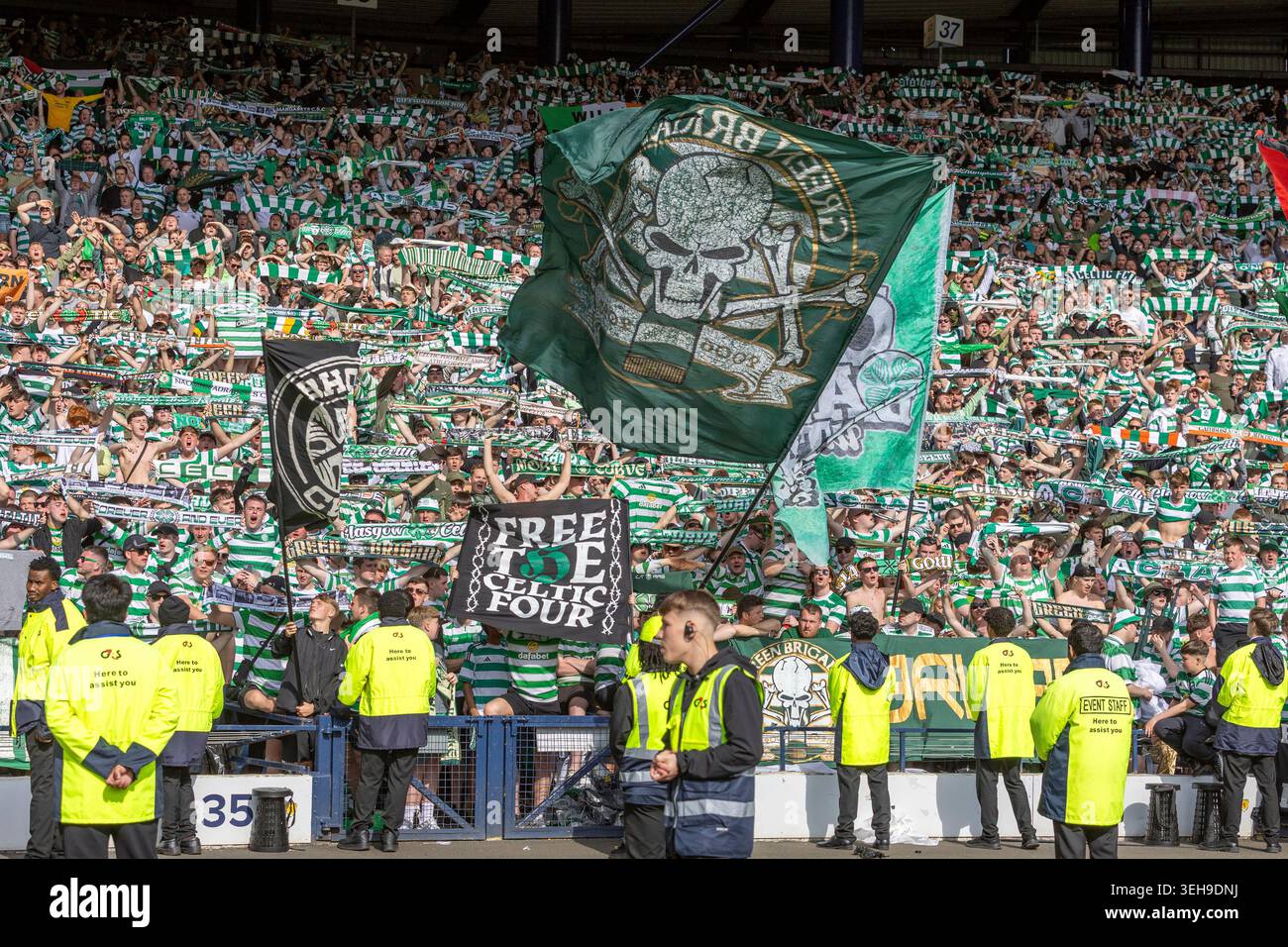 Glasgow, UK. 23rd May, 2026. Celtic played Dunfermline Athletic at Hampden Park, Glasgow, Scotland, UK in the final of the Scottish Gas Men's Scottish Cup. The final score was Celtic 3 - 1 Dunfermline Athletic. Celtic team were presented with the Scottish Cup at the end of the game. Image of the Gren Brigade Celtic supporters with police officers and security on the trackside. Credit: Findlay/Alamy Live News Stock Photo