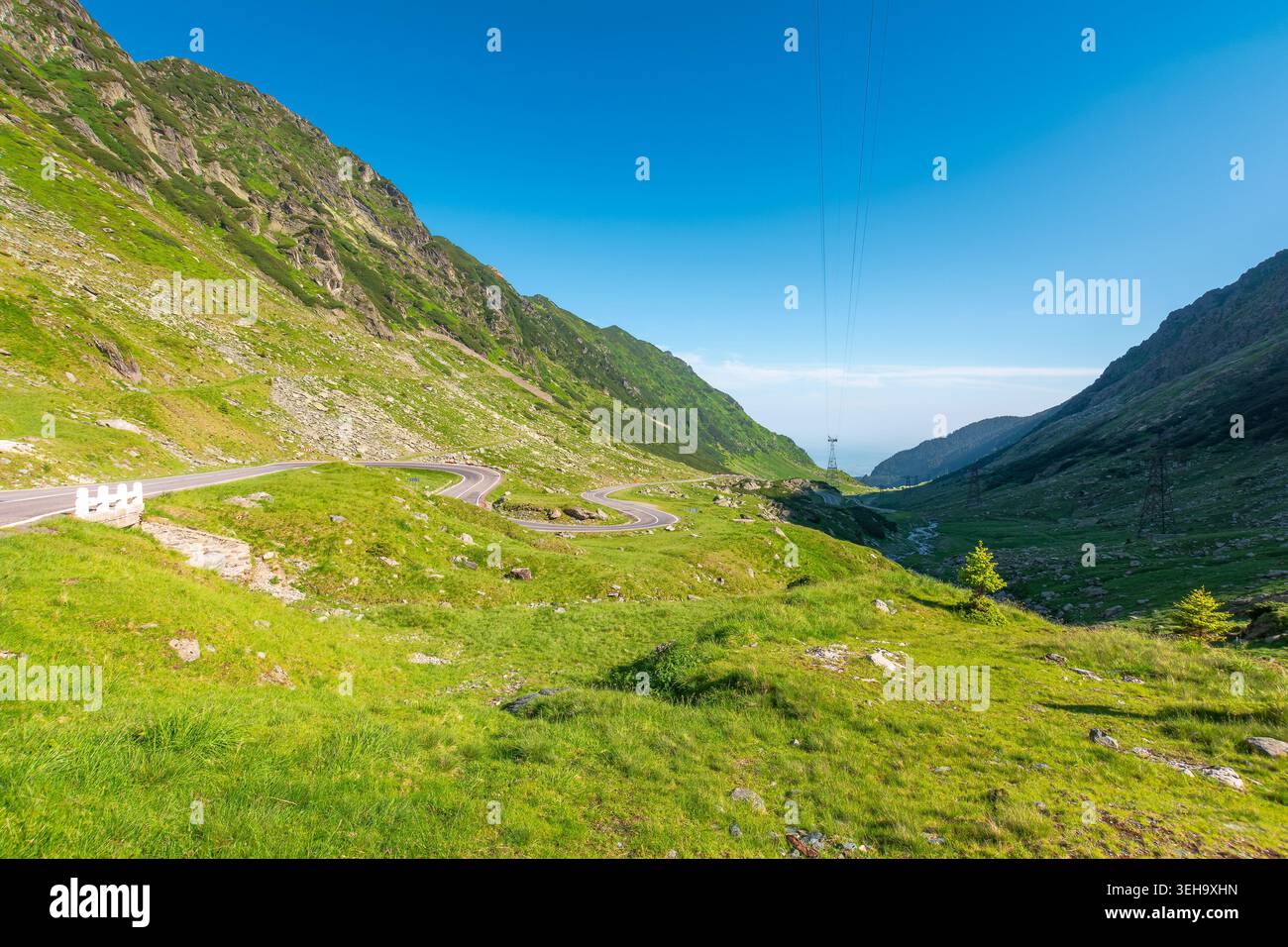 Transfagarasan road through mountains winding uphill. popular highway travel destination of Romania. nice view of mountain on summertime weather. road Stock Photo