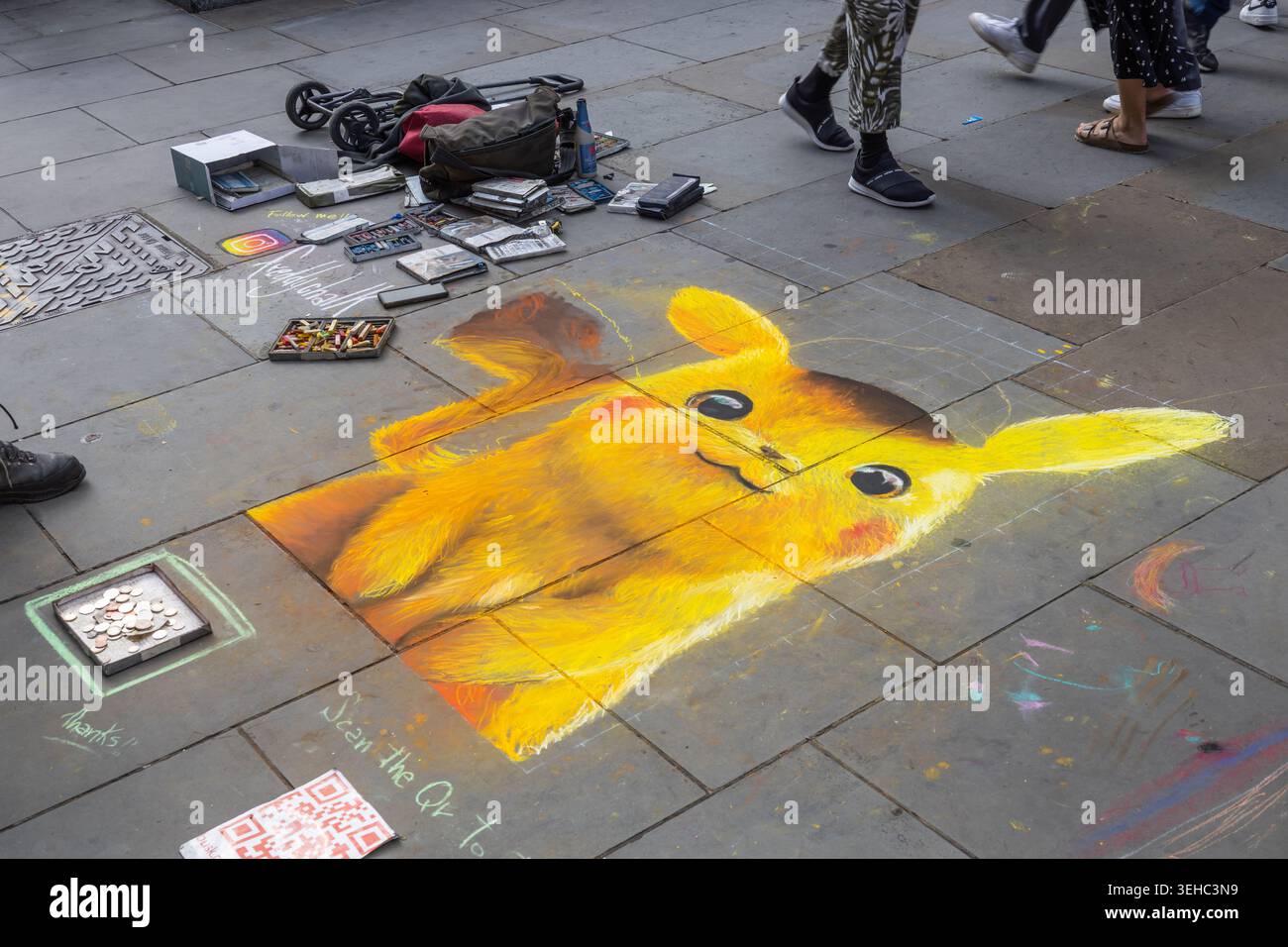 Chalk drawing of Pikachu on a city sidewalk. London, UK, 17 July 2023 Stock Photo