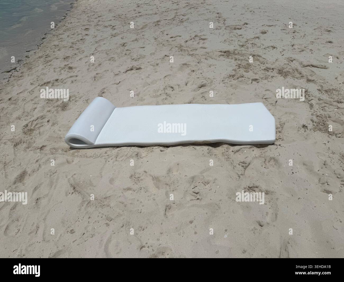 white floating mat on a caribbean beach Stock Photo