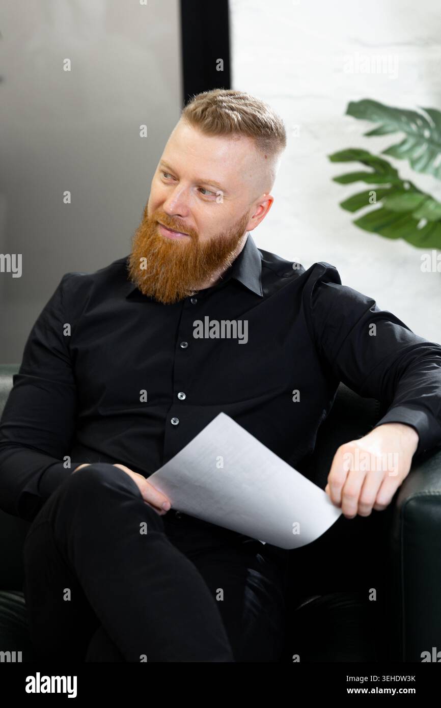 Confident businessman with beard during corporate discussion in office Stock Photo