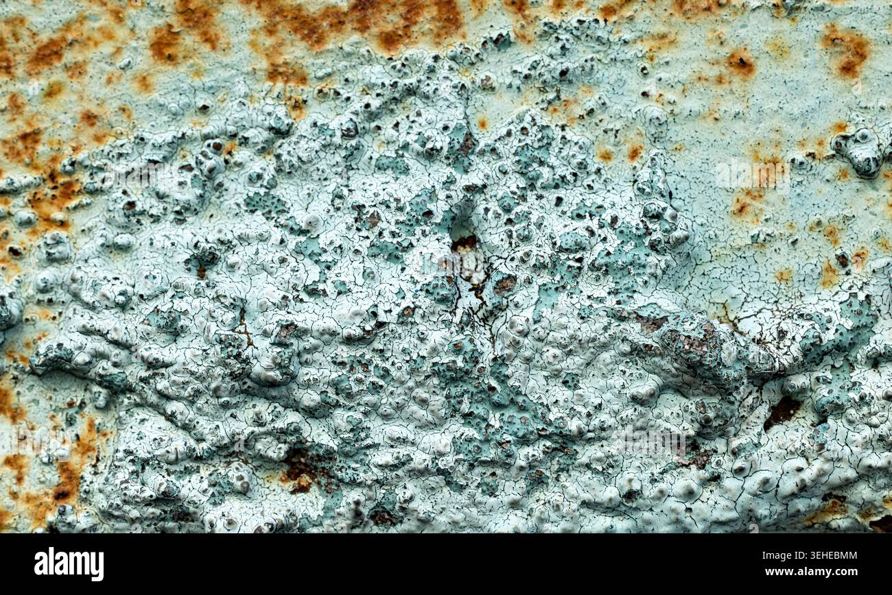 Weathered Rust and Peeling Paint Texture on Metal Surface with Cracks Stock Photo