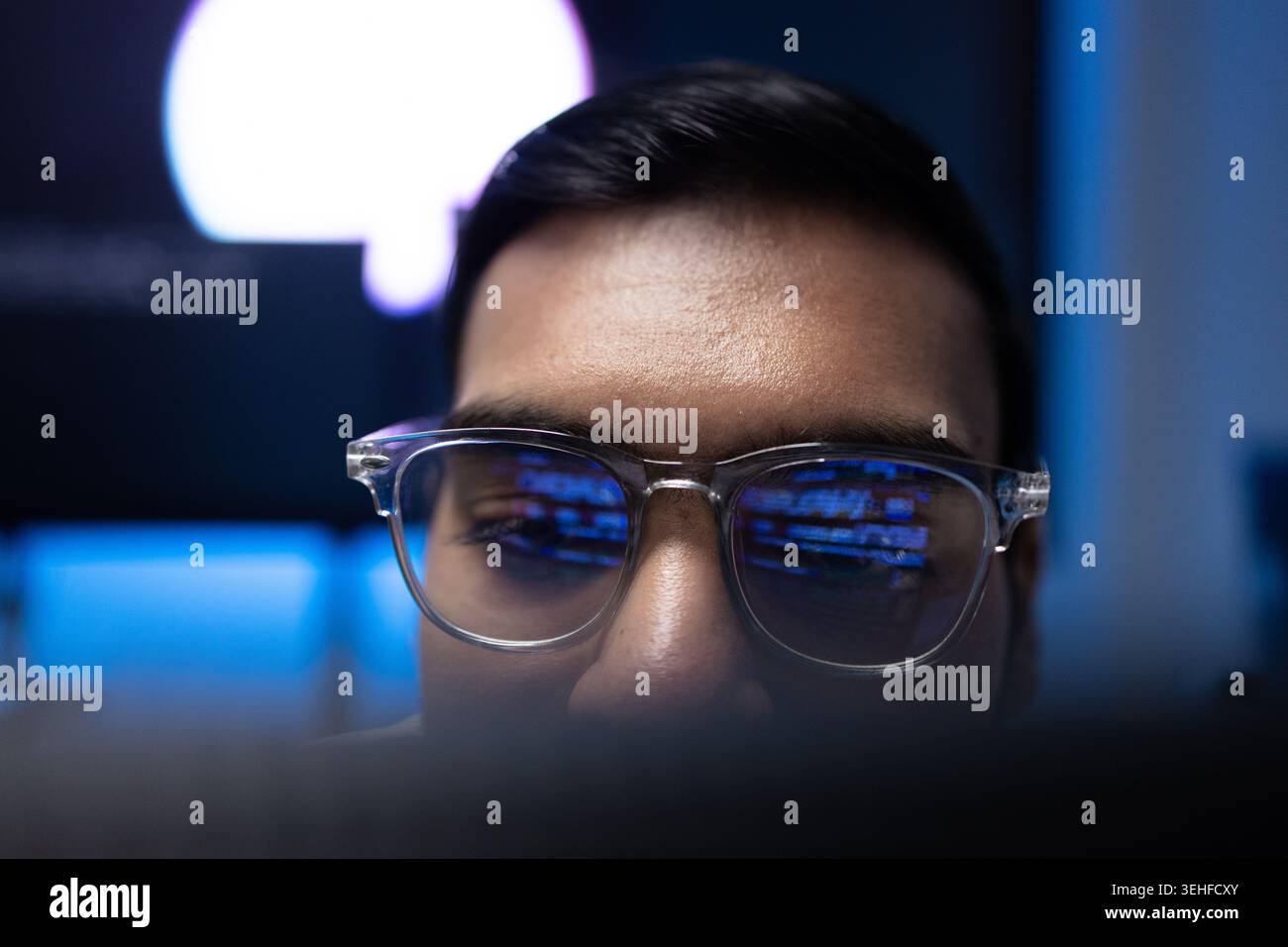 Indian Software Developer Wearing Glasses With Code Reflection On Lens Stock Photo