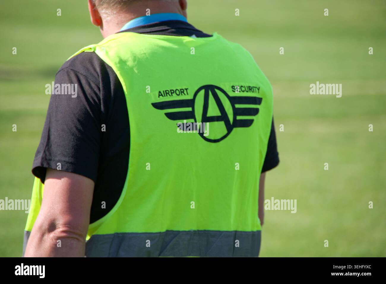 Rear view of a Airport Security Guard Stock Photo