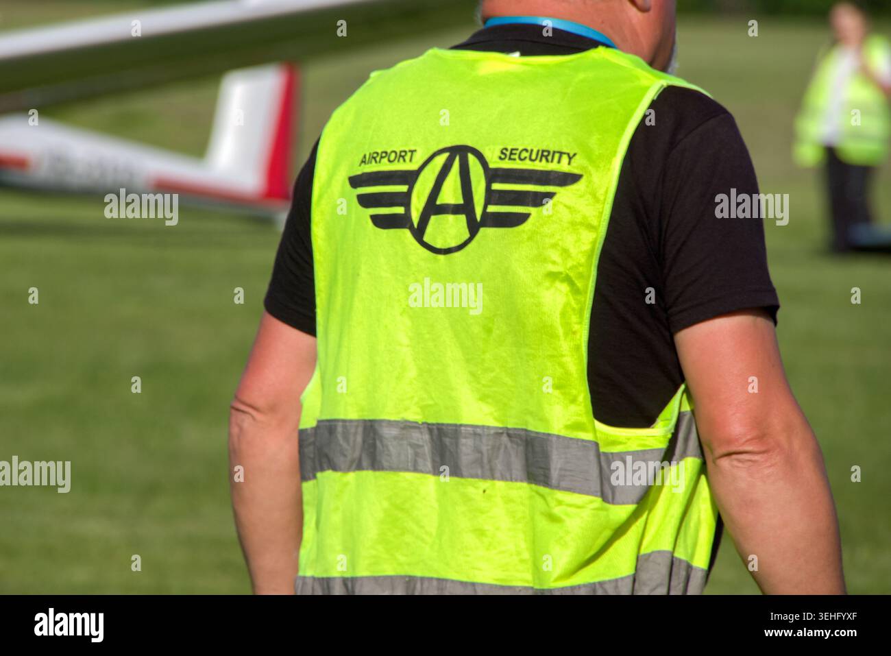 Rear view of a Airport Security Guard Stock Photo