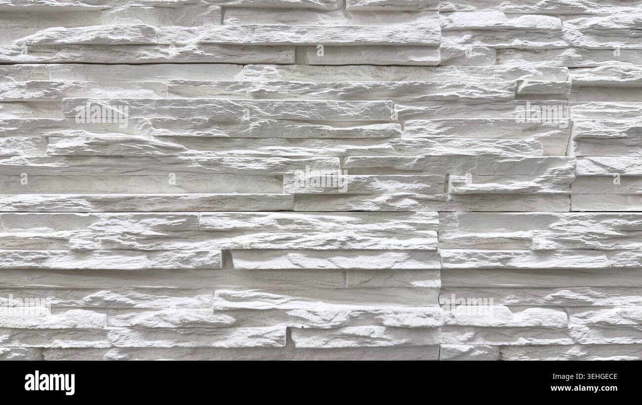 White layered stone wall texture close up Stock Photo